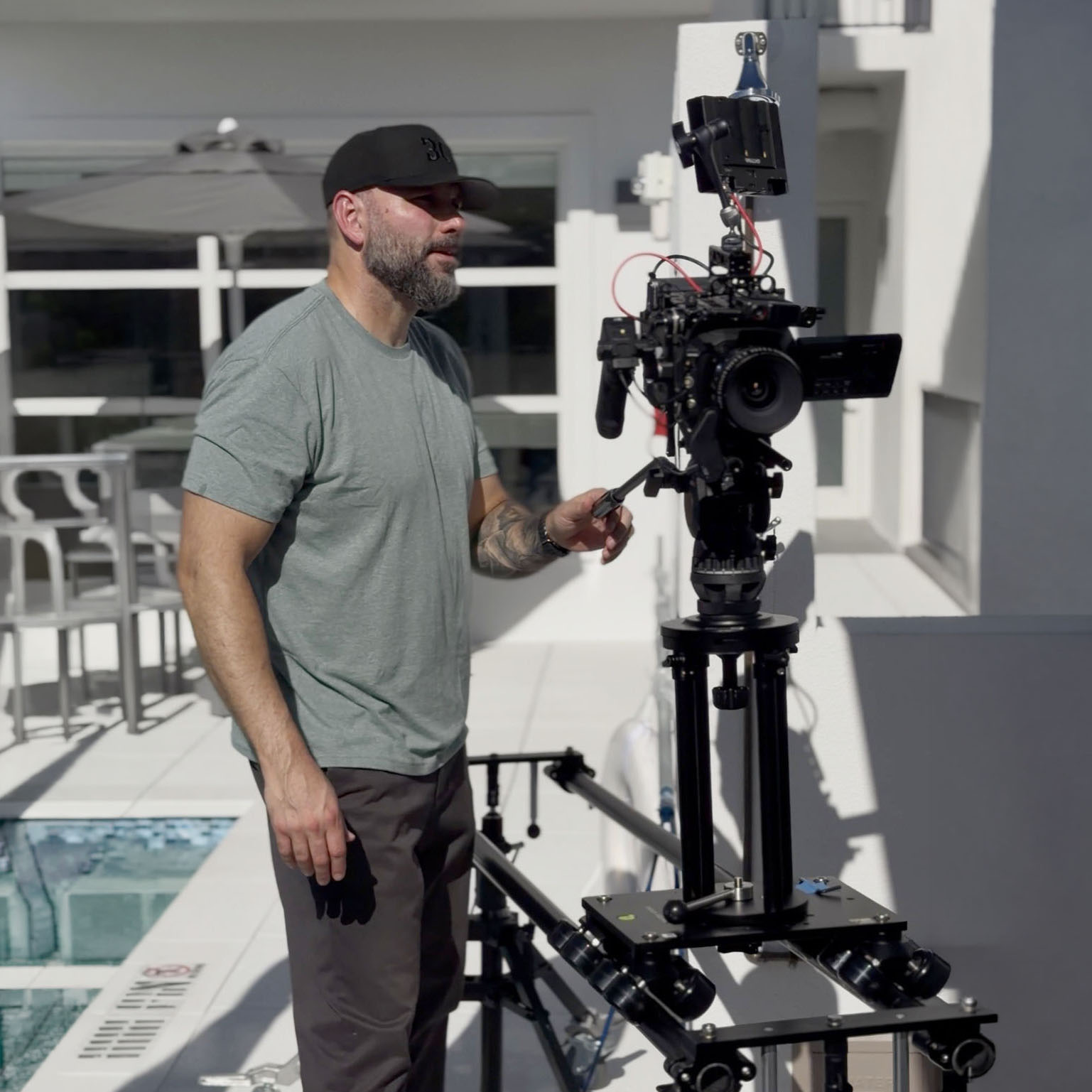 Osiris Ramirez operating a cinema camera on set